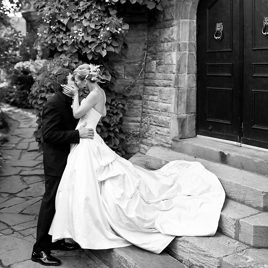 Casa Loma Wedding Toronto Bride and Groom Kissing on the stairs.