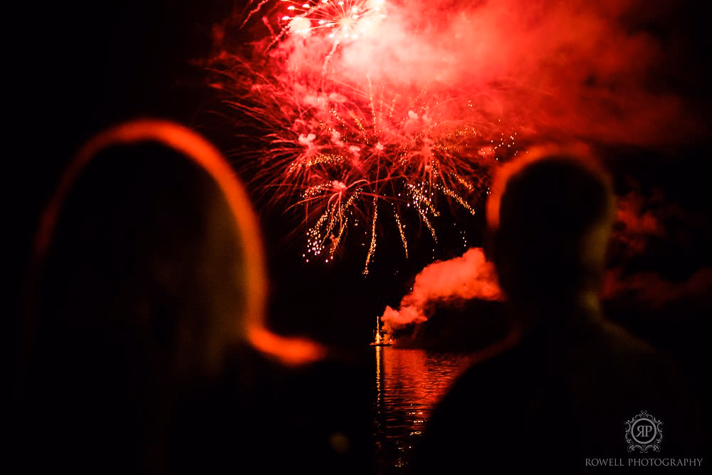a romantic backyard wedding guest watching fireworks